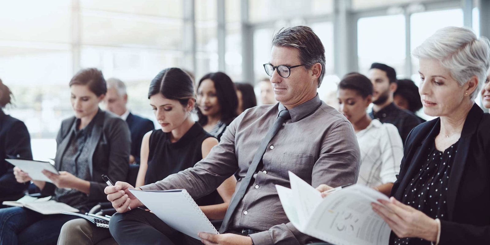 Group of businesspeople attending a conference.