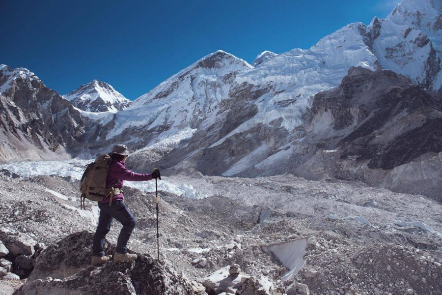 Women in purple sweater climbing Mount Everest